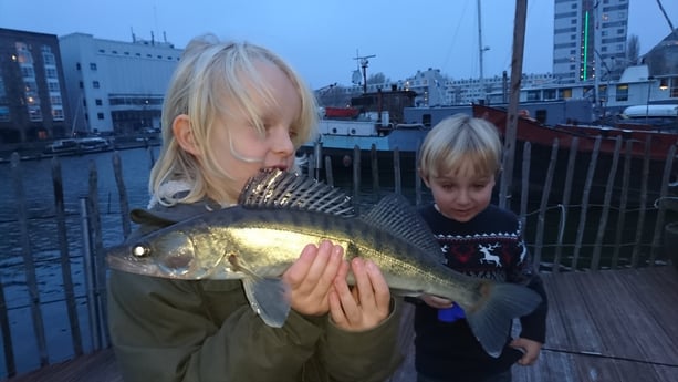 Our son with a zander caught from the houseboat.